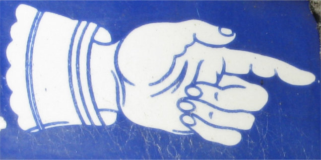 Blue and white ceramic hand with cuff pointing ight